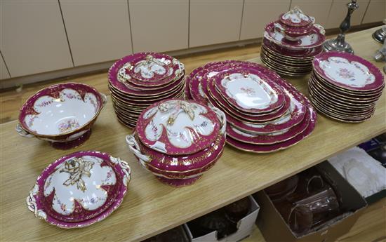 A late 19th/early 20th century large dinner service, bordered and gilded